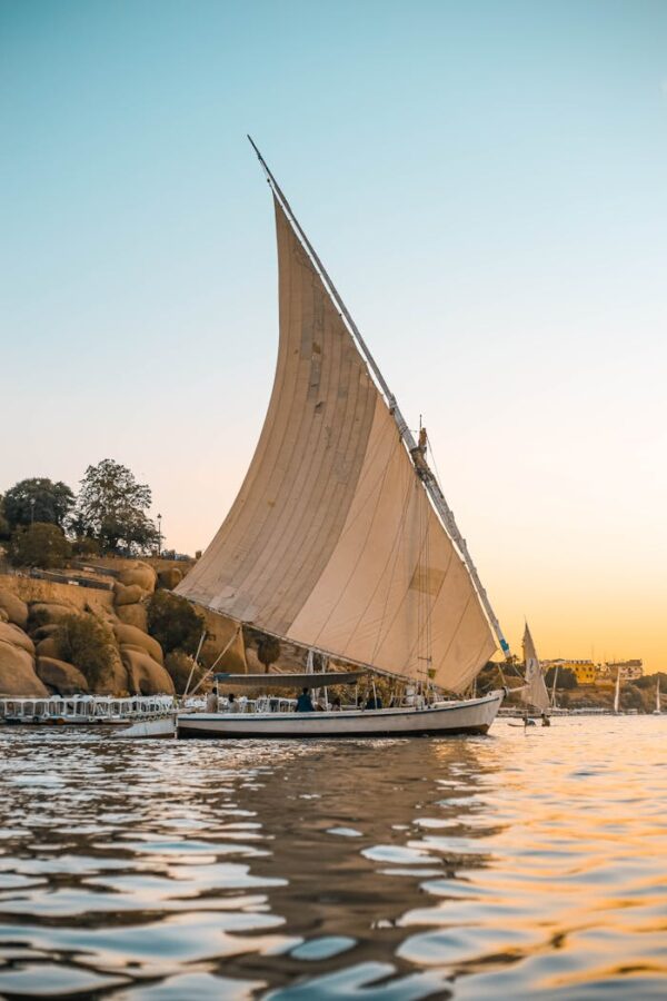 White Sail Boat on Water